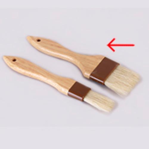Broad wooden handle brush